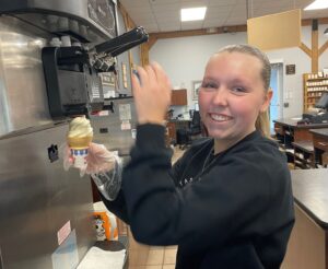 worker making an ice cream cone